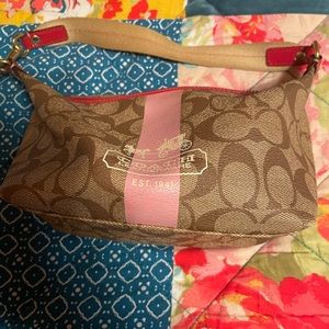 Authentic coach purse with coach and carriage logo